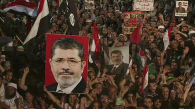 Pro-Morsi demonstrators with flags and posters