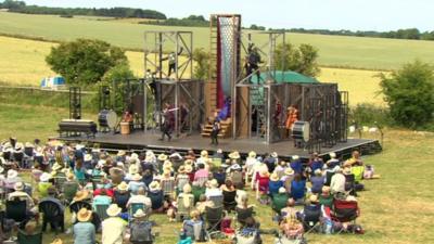 Actors perform onstage in Towton field