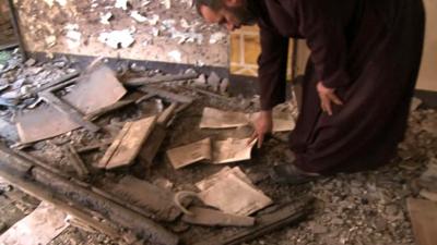 Father Ayoub Youssef in the looted church in the village of Dalga, Egypt