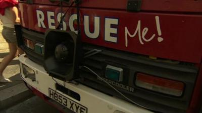 Fire engine with Rescue Me written on it