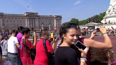 Tourists outside Buckingham Palace