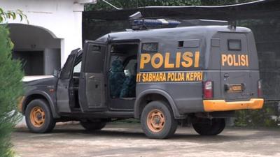 Police van outside Batam jail