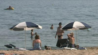 People sat on beach