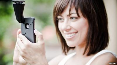 A woman using GoPano camera