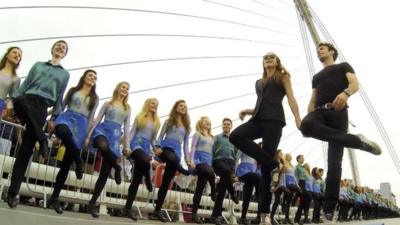 Jean Butler and Padraic Moyles lead the cast of Riverdance on Samuel Beckett Bridge