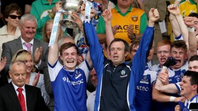 Kevin Loughran lifts the Father Murray Cup