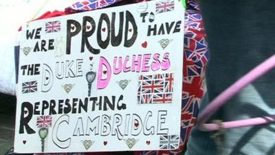 Some supporters have made signs for the Royal couple