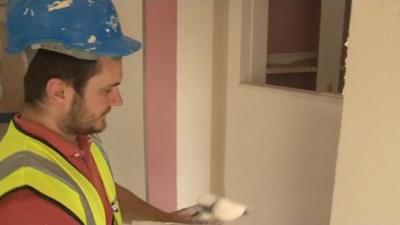 Plasterer finishing schools walls