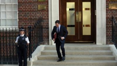 Press Secretary Ed Perkins on steps of St Mary's hospital