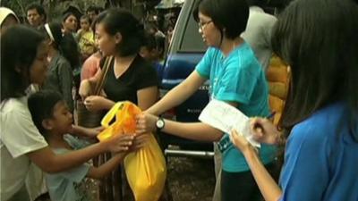 A food package being handed to a needy family