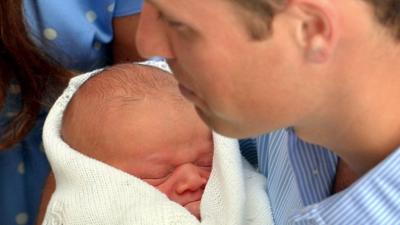 Prince William holding Prince George of Cambridge