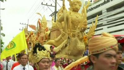 Giant candles being paraded through the streets of Thailand