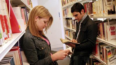 Students reading textbooks