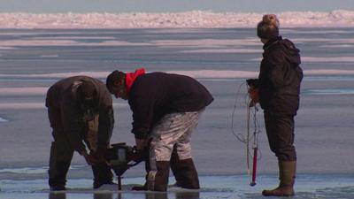 Checking the thickness of ice in Alaska