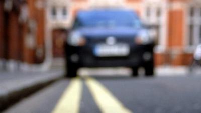 Car parked on double yellow lines