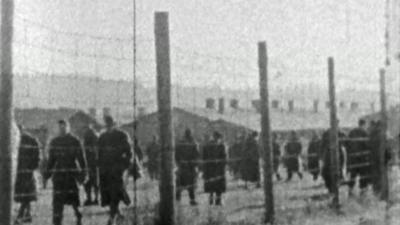 Archive film of prison fence