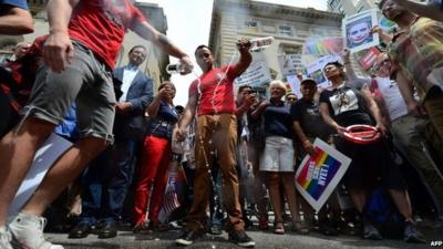 Protesters pouring Russian vodka onto street outside Russian consulate in New York