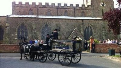 The horse drawn hearse at Susan Taylor's funeral