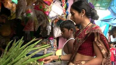 Woman buys vegetabales