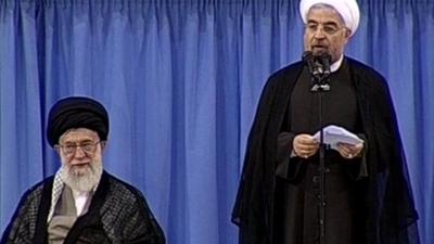 Hassan Rouhani (right)