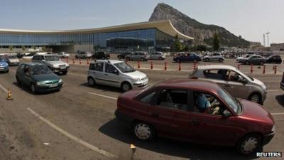 Vehicles wait in line to enter to Spain from Gibraltar