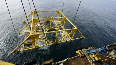 The extractor frame is lowered into the sea