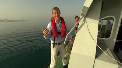 The BBC's Tom Burridge on a boat in the sea off the coast of Gibraltar