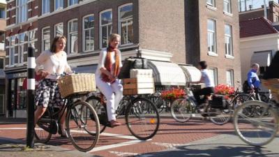 Women at Dutch bicycle traffic lights