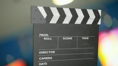 Still of director's clapper board