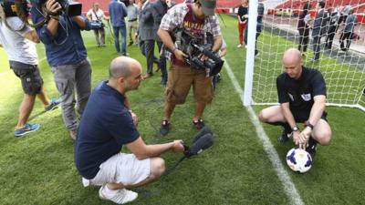 Referee shows how the new goal line technology works