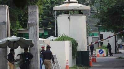 Pakistani security officers outside the US consulate in Lahore