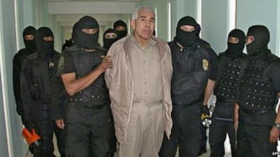 Rafael Caro Quintero in handcuffs with police