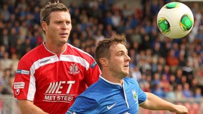 Portadown's Kevin Braniff in action against Linfield's Jamie Mulgrew