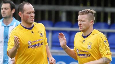 James Costello celebrates with goalscorer Matt Hazley