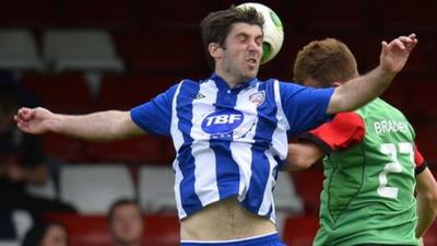 Match action from Glentoran against Coleraine at The Oval