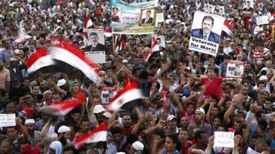 Members of the Muslim Brotherhood and supporters of deposed Egyptian President Mursi chant slogans at Rabaa Adawiya Square