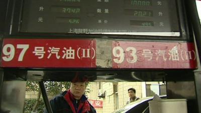 Chinese man at petrol pump