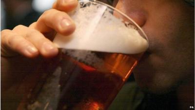 Man drinks pint of ale