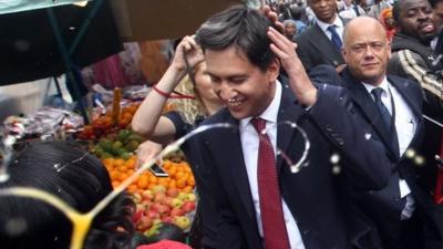 Labour leader Ed Miliband after he was pelted with eggs during a campaign visit in East Street market in Walworth, south London