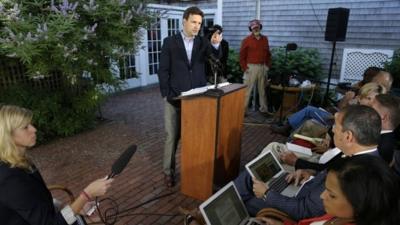 White House deputy press secretary Josh Earnest faces reporters during a news conference at a hotel