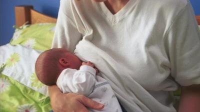 A baby being breastfed