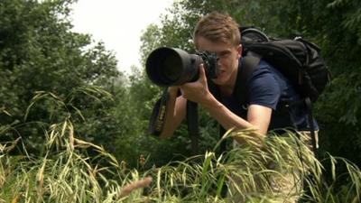 Sam Rowley taking wildlife photographs