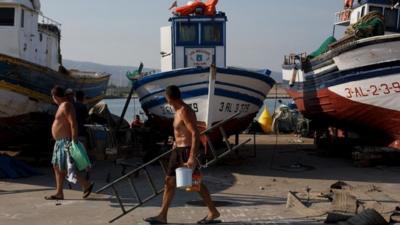 Fishermen walk at Atunara Port on August 17, 2013 in Linea de la Concepcion, Spain