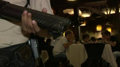 Armed guard at restaurant