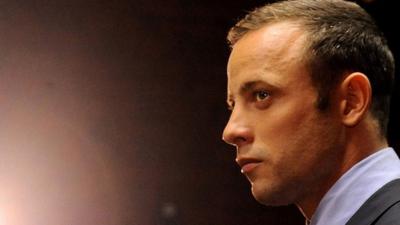 In this Friday, Feb. 22, 2013 file photo Olympic athlete Oscar Pistorius stands in the dock during his bail hearing at the magistrates court in Pretoria, South Africa