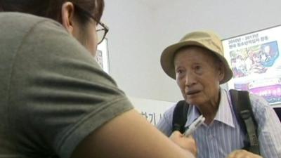 Man registering for family reunion