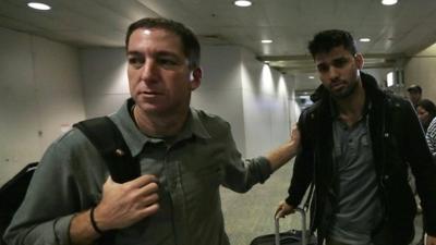 Glenn Greenwald (l) with his partner David Miranda in Rio de Janeiro's International Airport