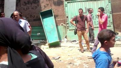 Coffin leans against wall inside Cairo's main mortuary