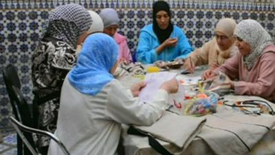 Women sewing bags