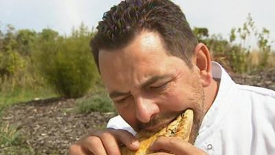 French chef Stephane Sauthier eating a Cornish pasty